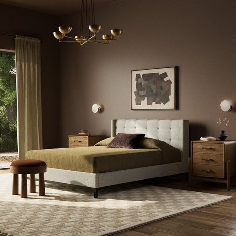 Cream colored upholstered luxury bed with modern solid wood nightstand