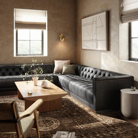 Modern living room with leather sofa, coffee table, accent chair and end table. 